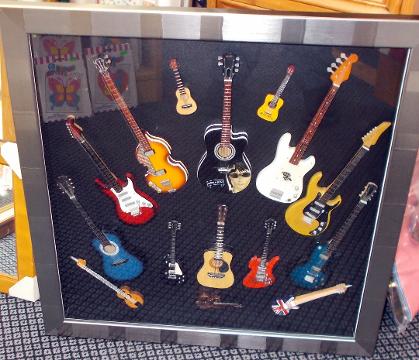 Box framed collection miniature guitars