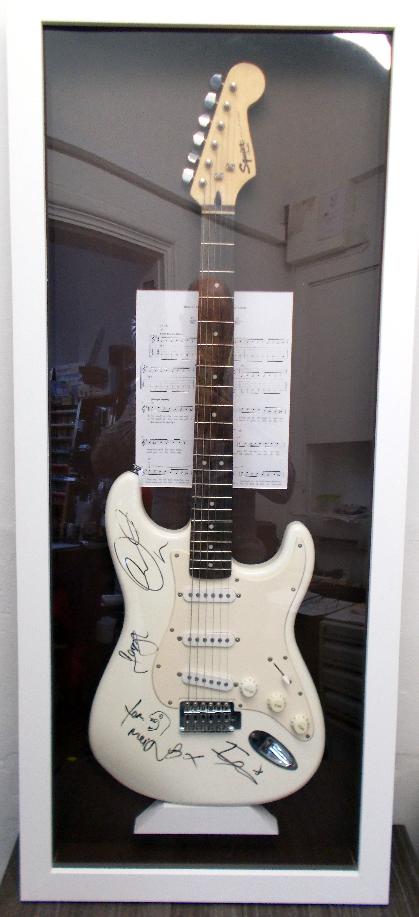 Box framed full sized electric guitar